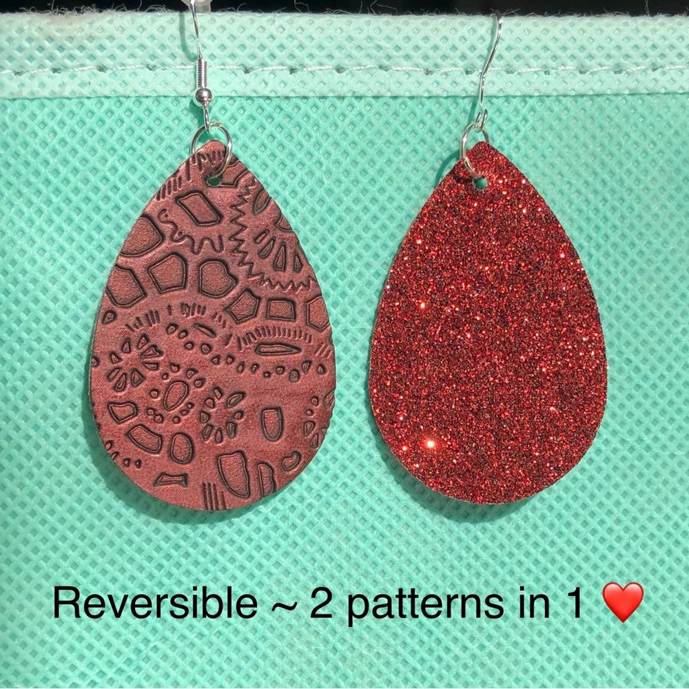 Sparkly red and stamped red bronze reversible faux leather teardrop earrings
